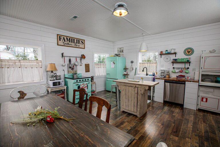 Farmhouse Cabin 16 kitchen is stocked with pots, pans and cooking utensils